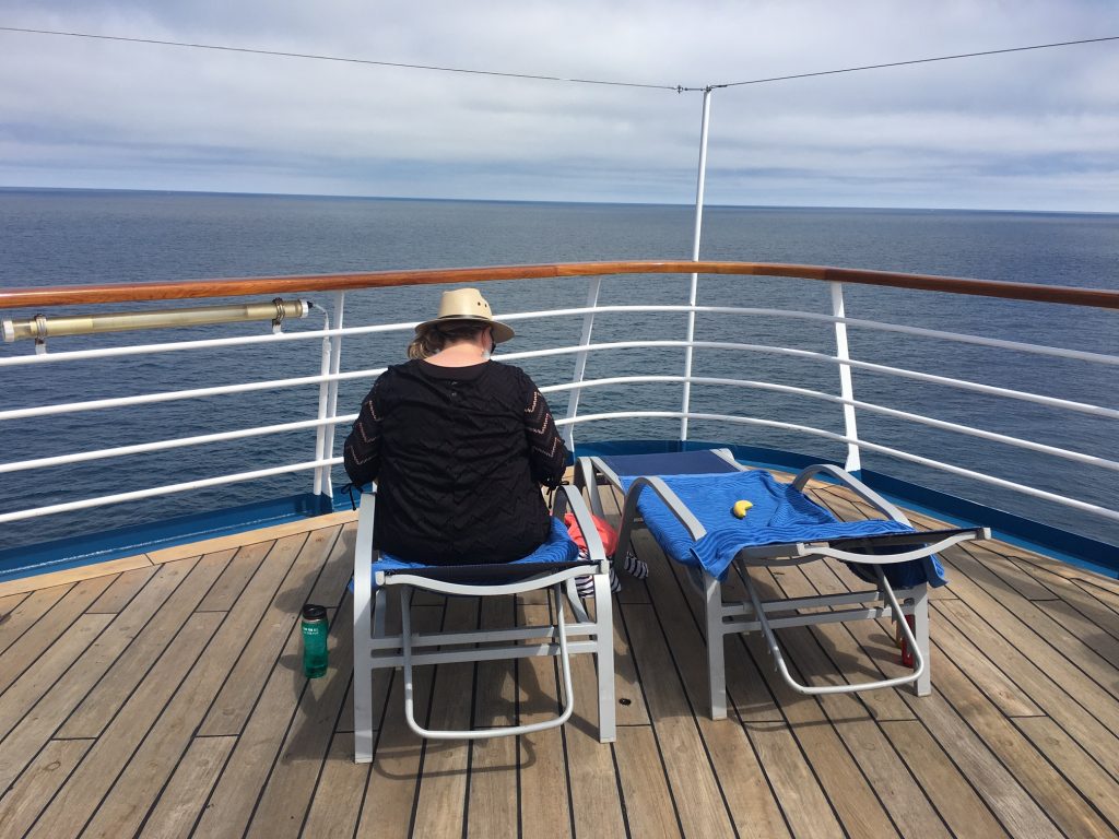 Cruise ship travel, deck, lounge chairs, ocean