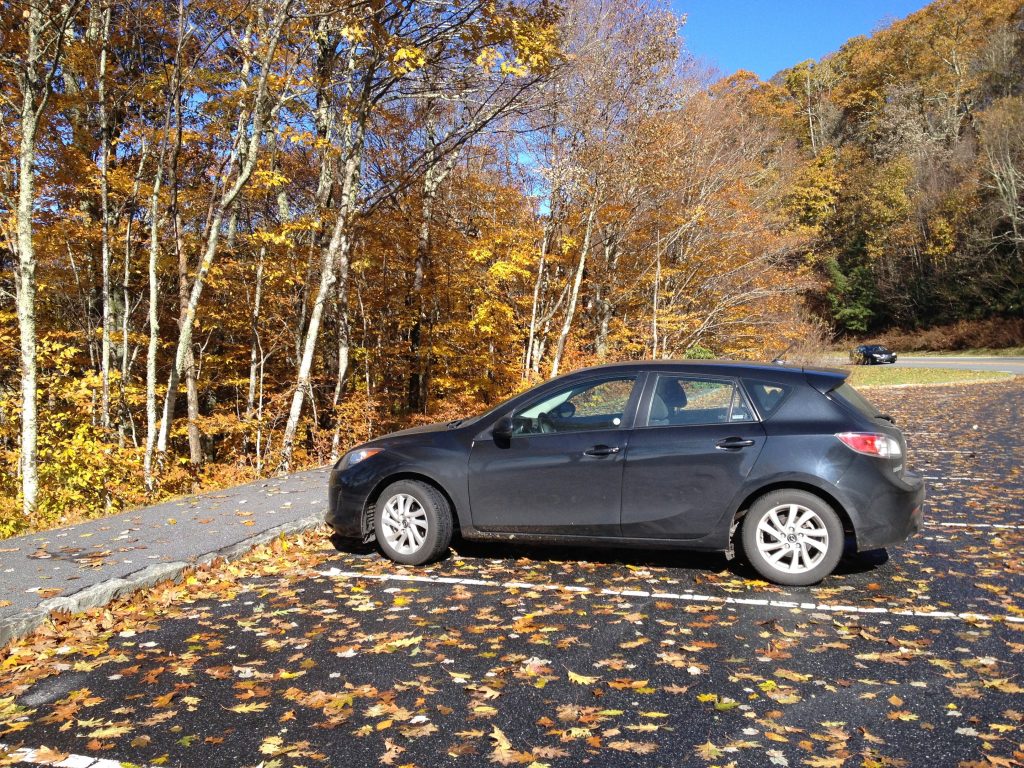 Mazda car rental in front of leaves turning colors