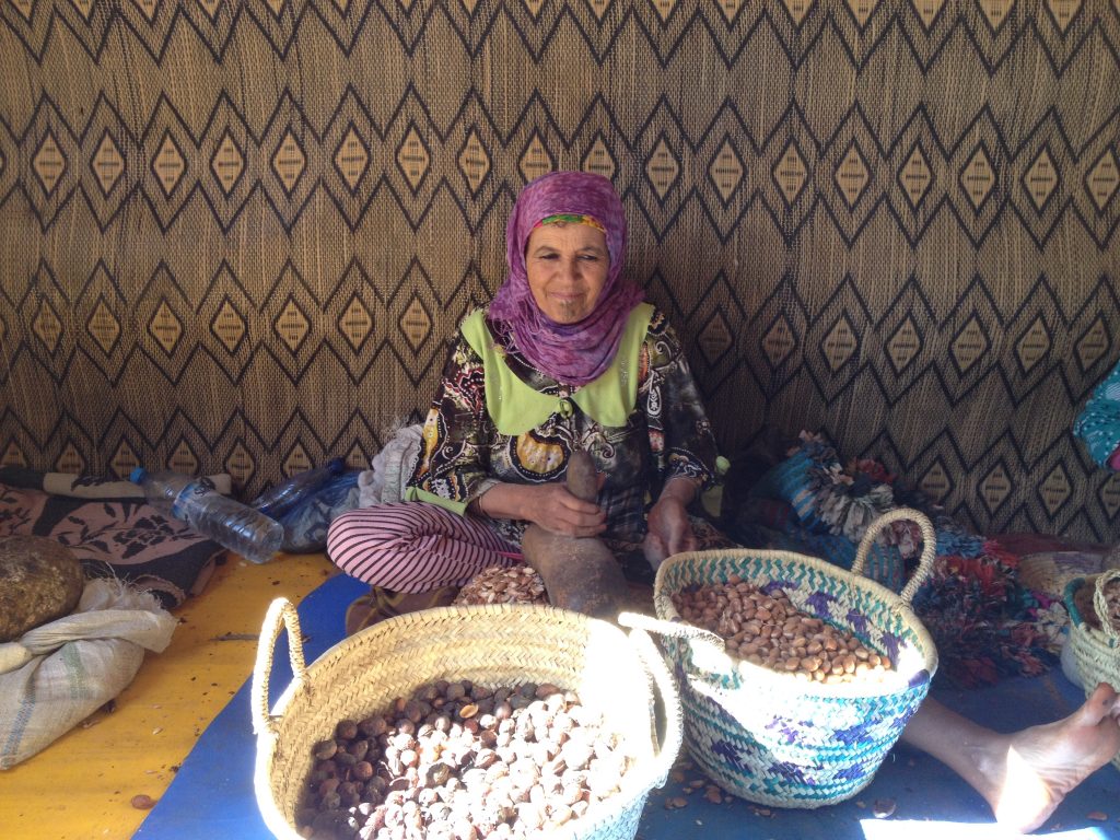 Women working with Argan Tree seeds to make oil