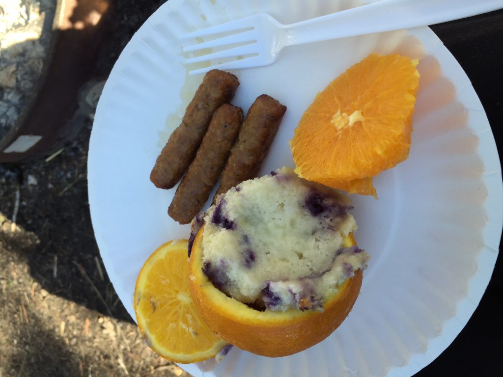 Blueberry Muffins baked over campfire in an orange