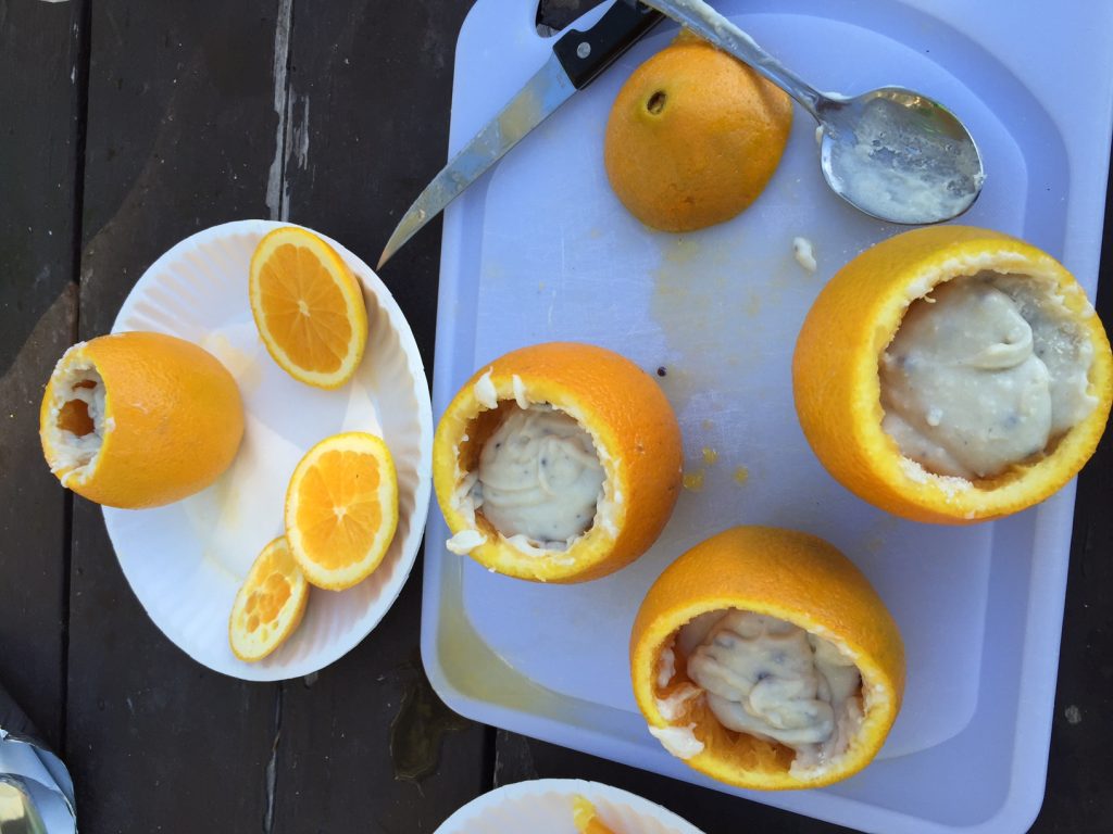 Blueberry Muffins baked over campfire in an orange