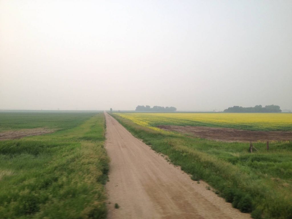 North Dakota, train travel, window views, mist, dirt road