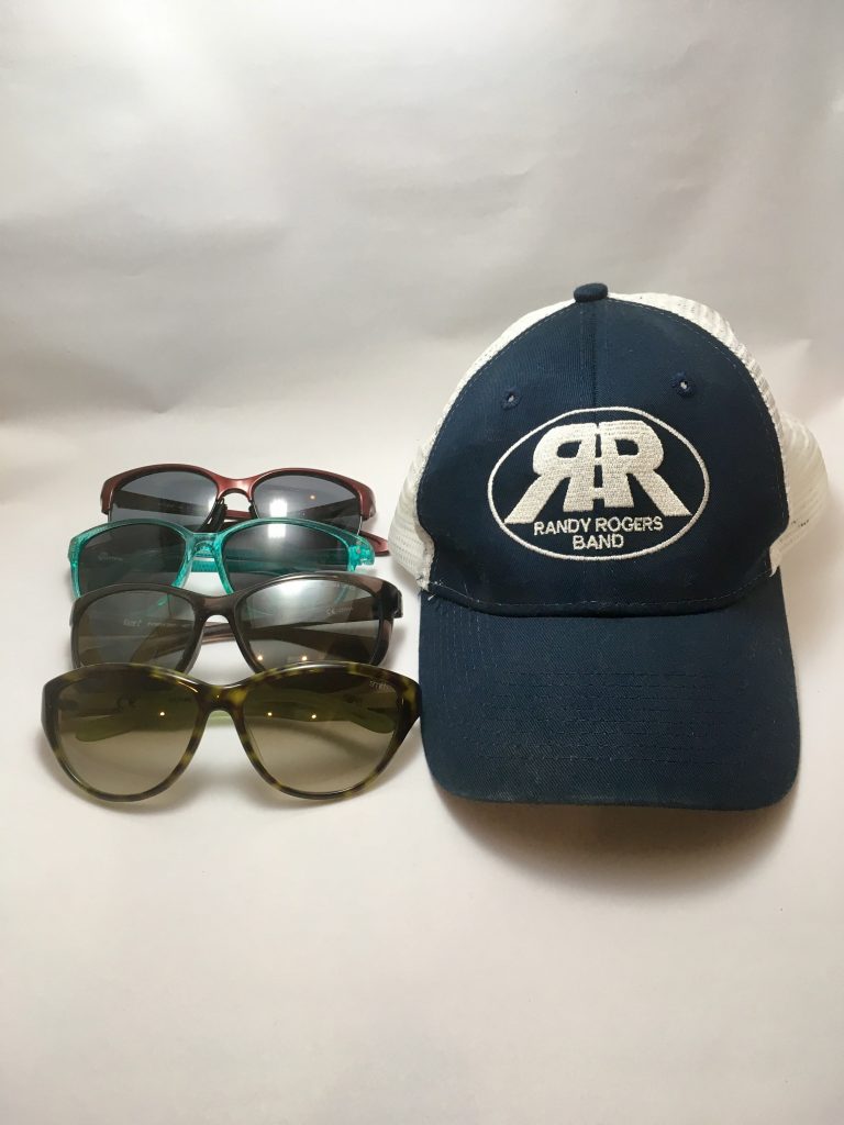 Sunglasses and a hat summer music festival preparation