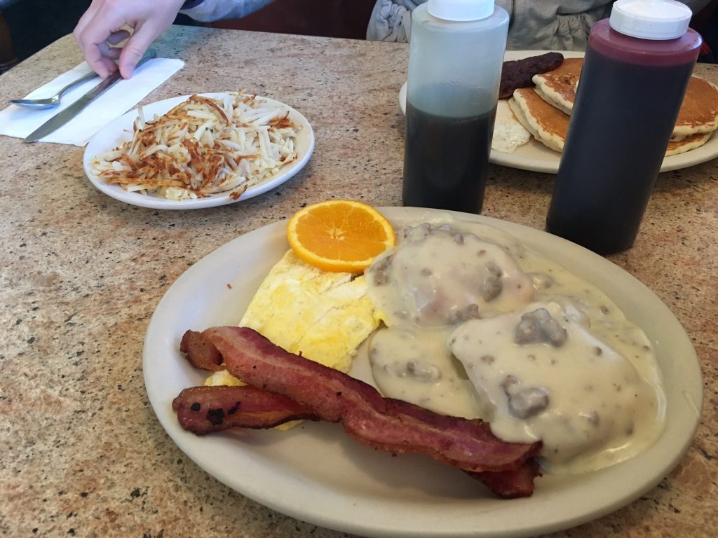 Diner breakfast with biscuits and gravy, bacon and eggs, casino
