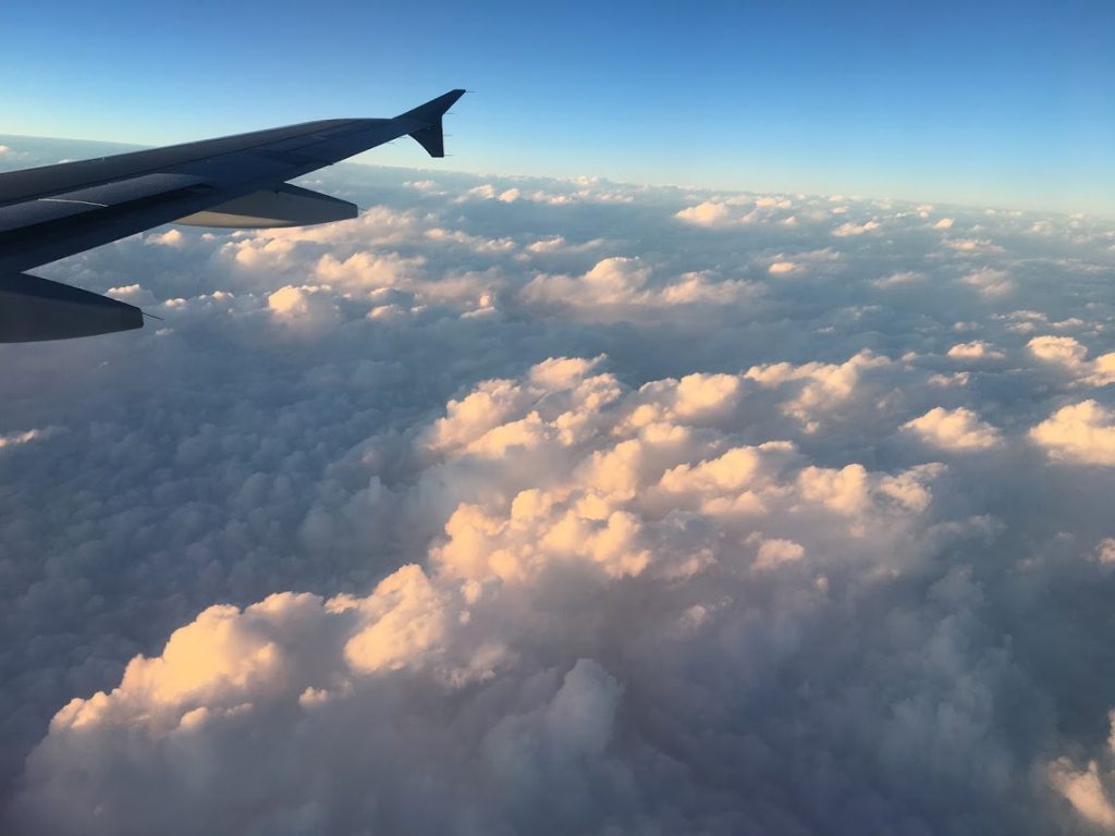 Clouds from a plane window, not-so-fun travel