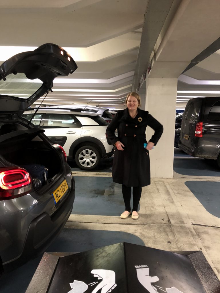 Amsterdam Netherlands airport rental car pick up Citron long black coat