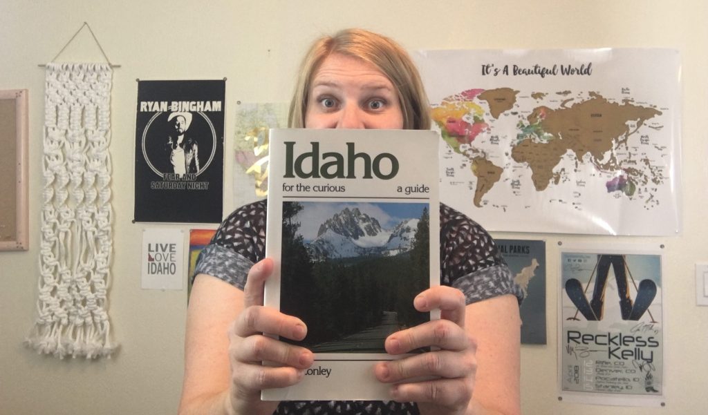 girl holding a book, Idaho for the curious, guide