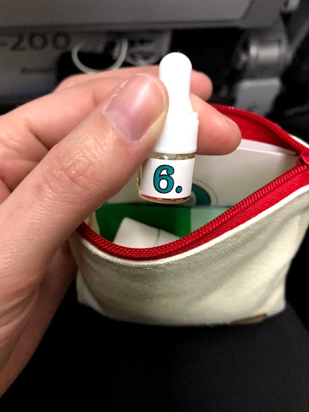 2 ml bottle with face oil for a diy airplane facial kit