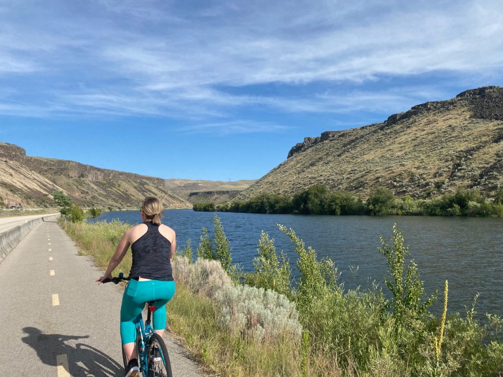 girl biking Boise Greenbelt Lucky Peak State Park