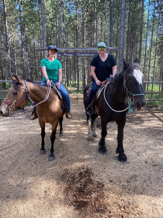 Two girls, two horses at Dry Ridge Outfitters in Idaho.