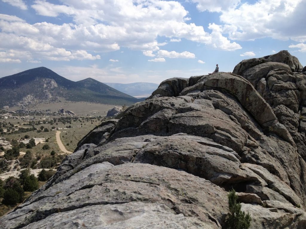 Sitting on a big boulder at the city