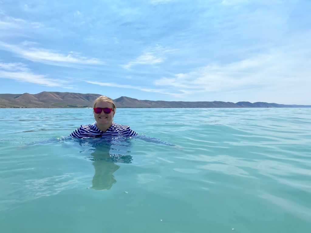 girl in turquoise water at Bear Lake State Park during an Idaho State Parks Challenge
