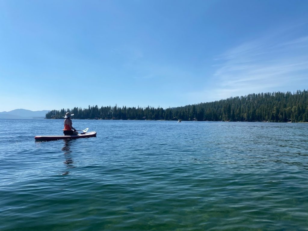 Girl on a paddleboard on Priest Lake, Idaho.