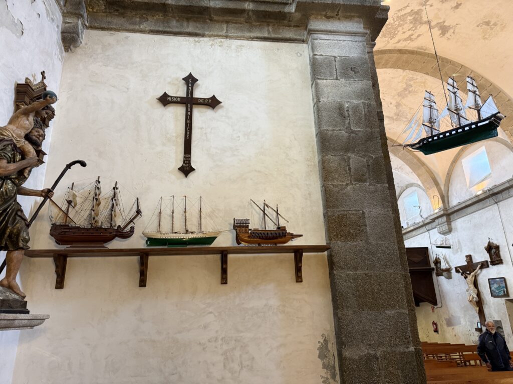 Christian church with cross and ships on the wall