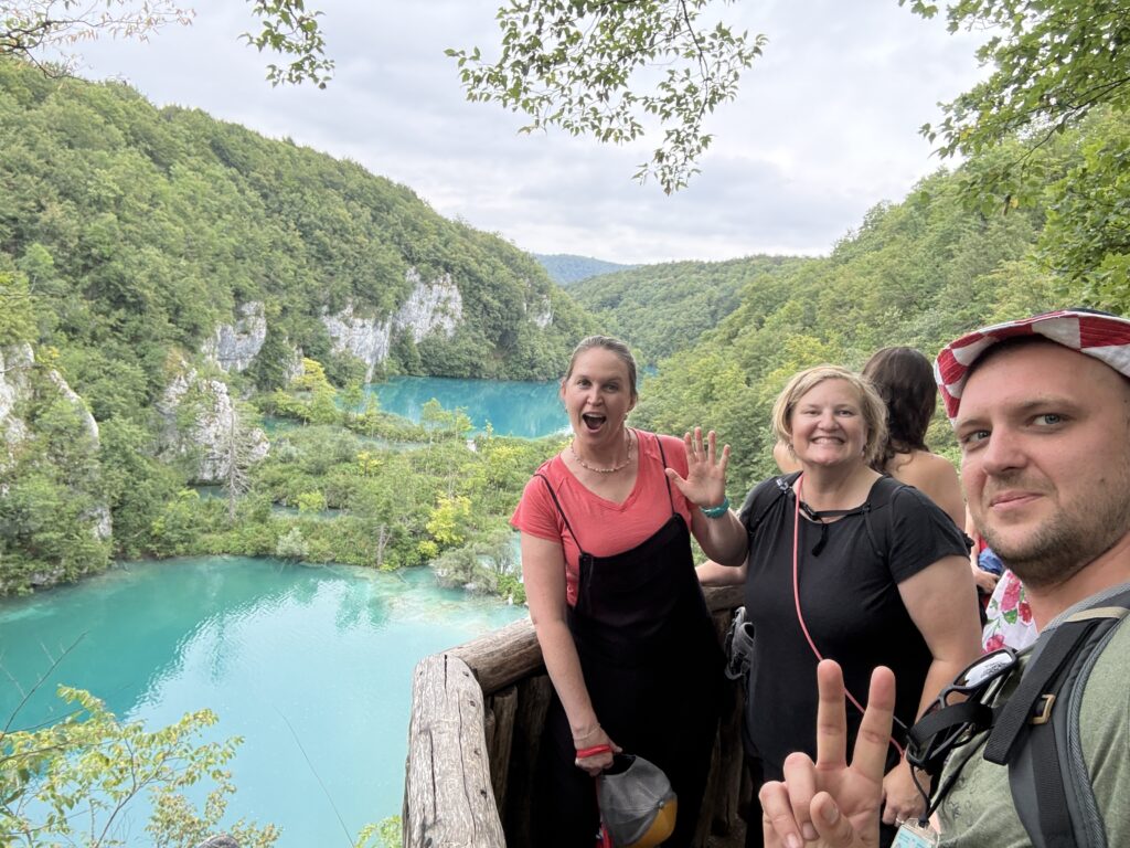 tourists in front of blue water lakes