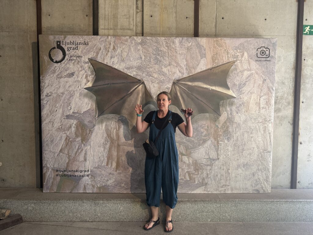 woman in front of dragon wings