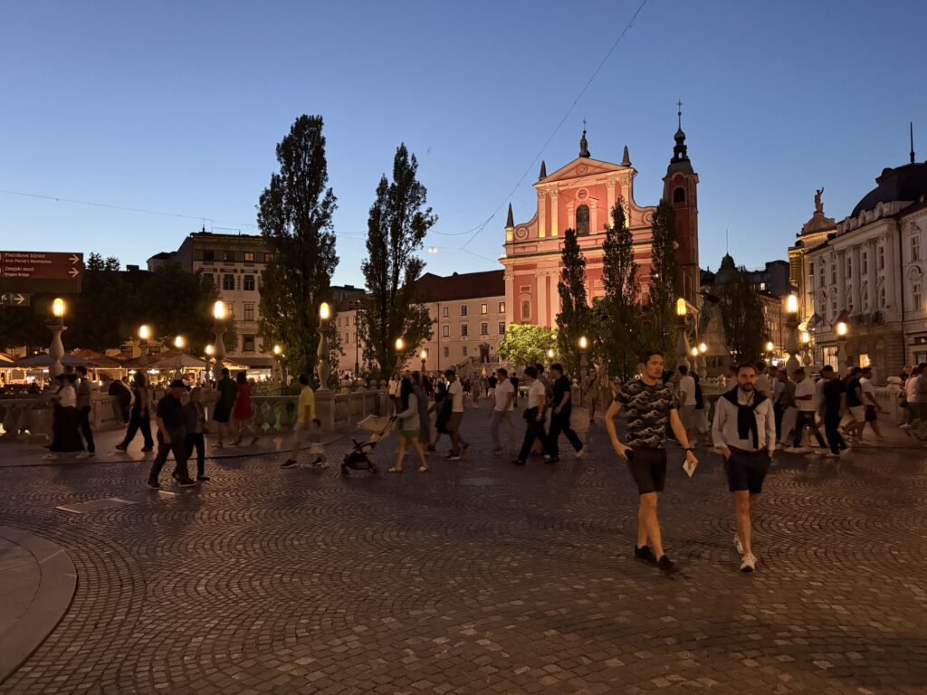 busy square with pink church