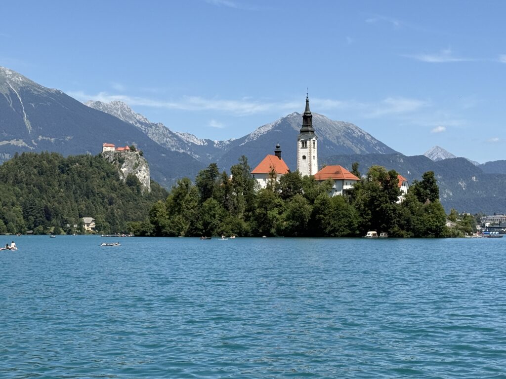 blue water with white church on islans
