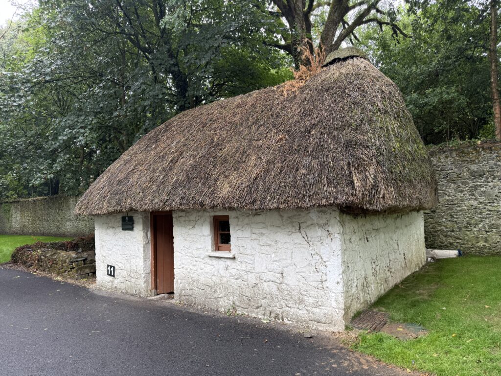 white building with thatched roof