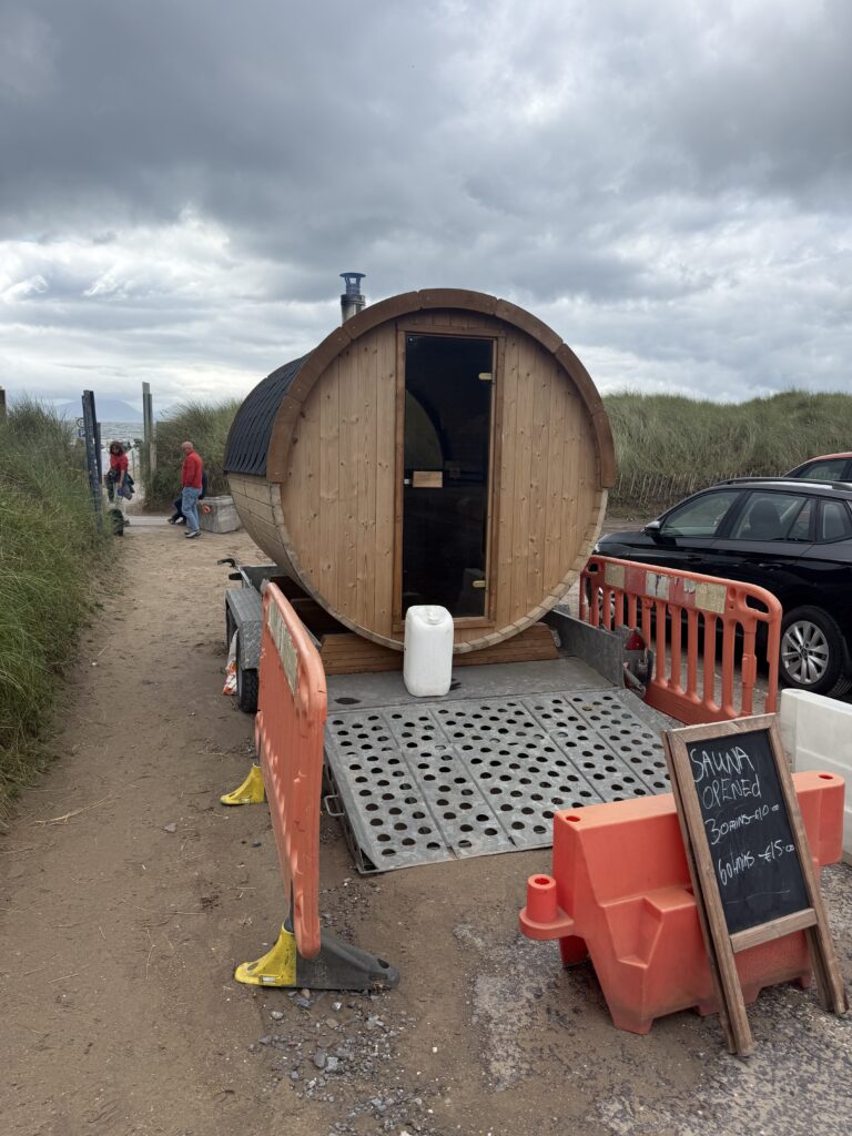 round wooden sauna on a trailer