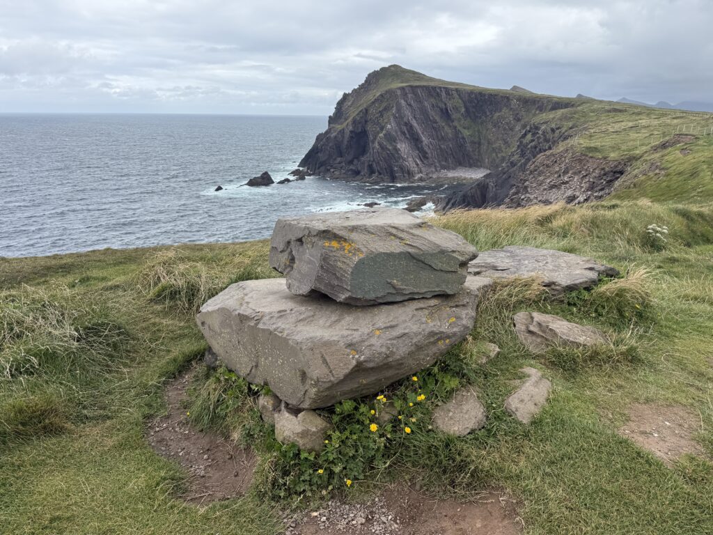 rocks overlooking a cliff and beach