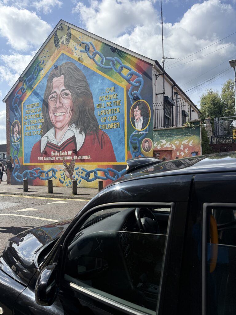 mural on building of a man from the early 80s