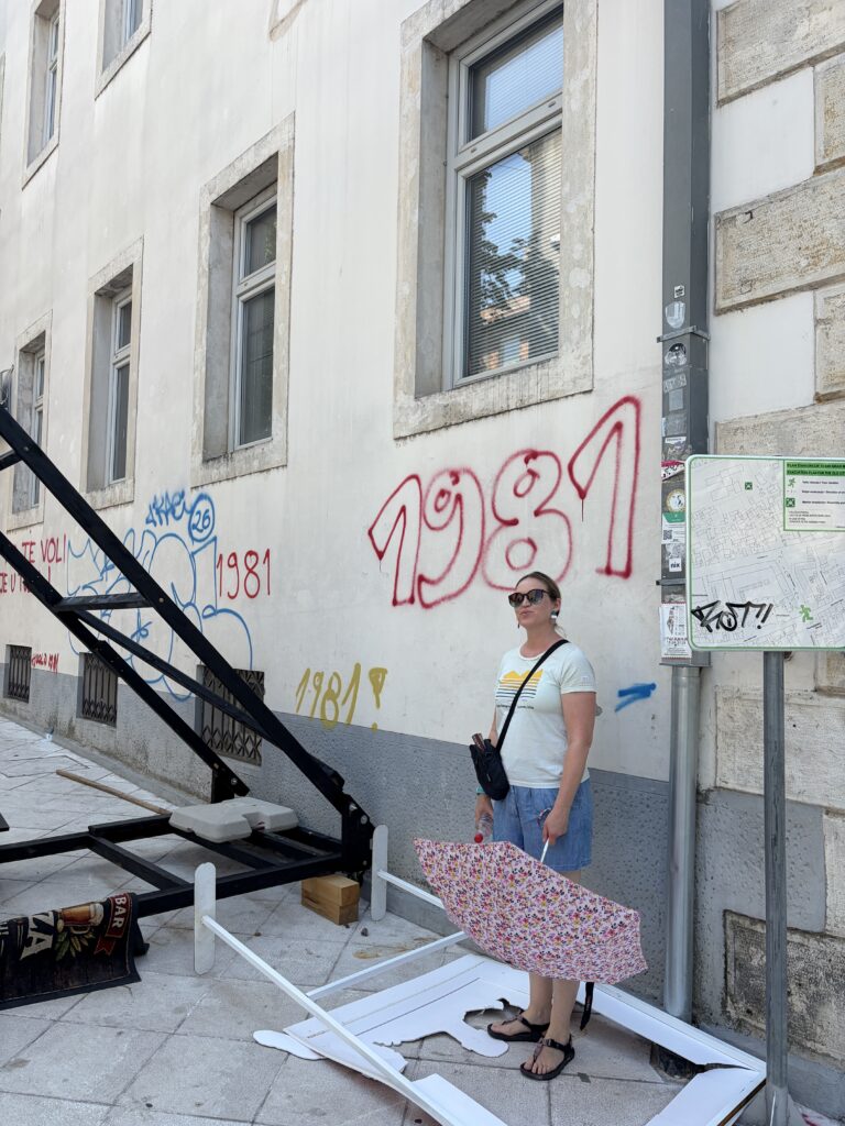 woman in front of graffiti