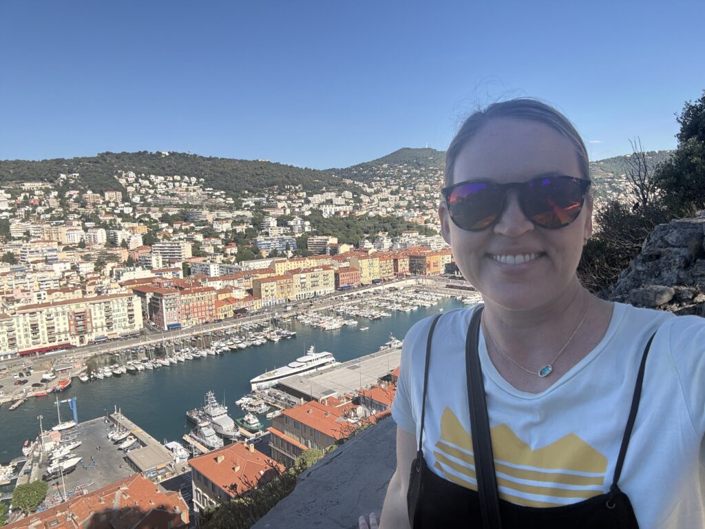 Smiling in front of the Nice background
