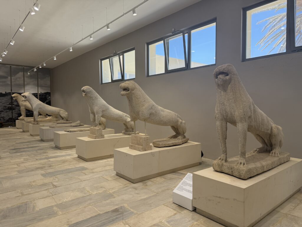 Several carved cat like statues