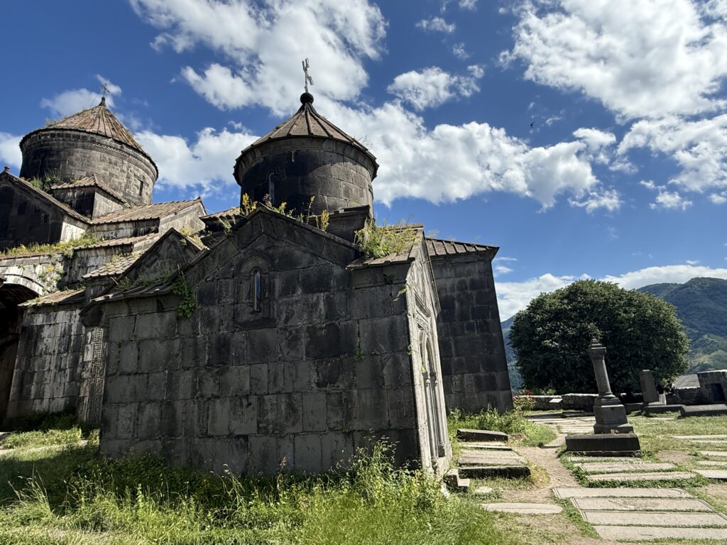 Green hill and stone monastery