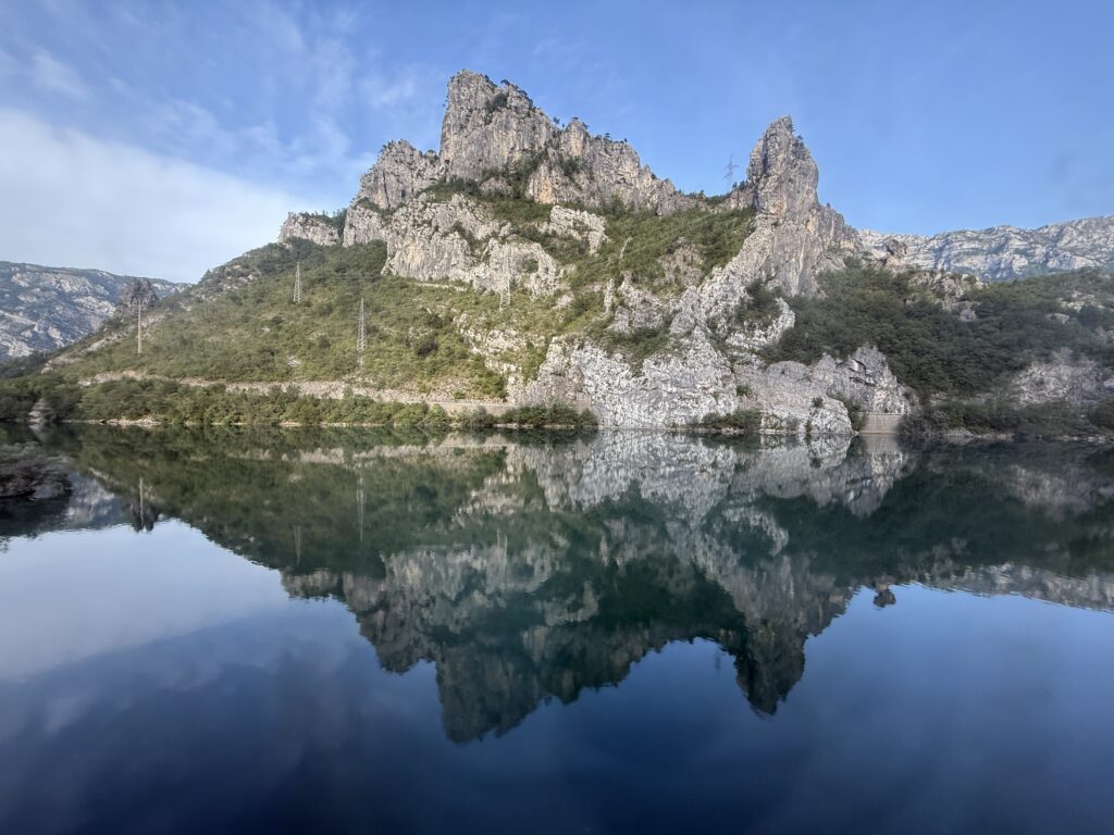 large mountain reflected on river