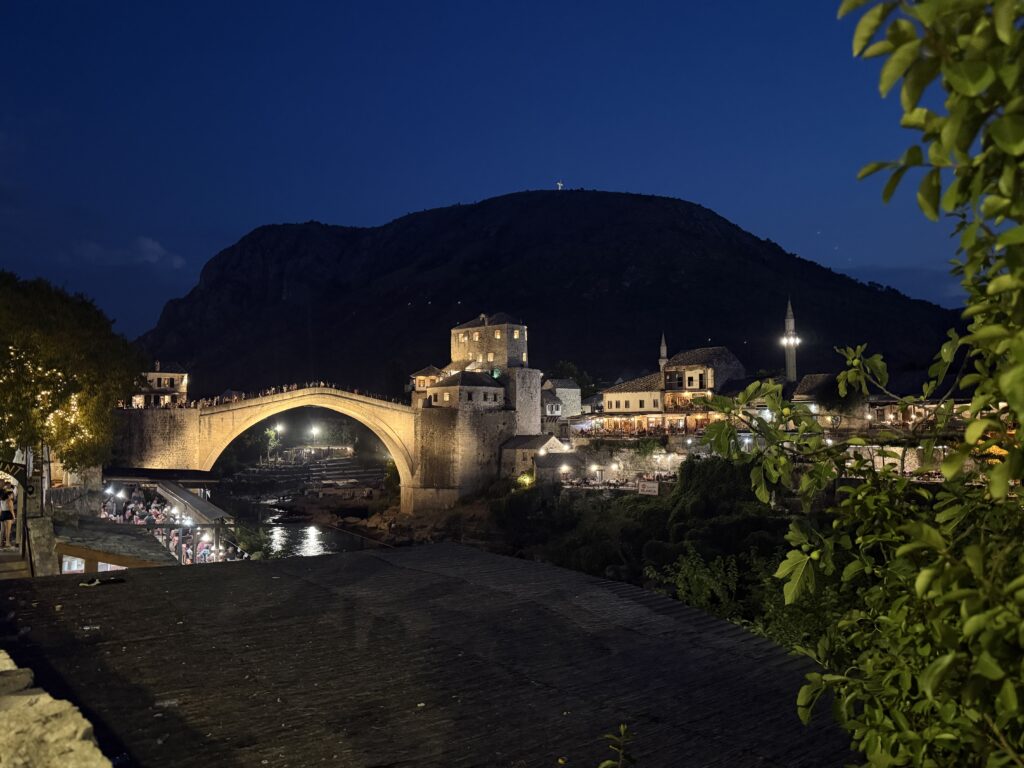 stone bridge lit up at night